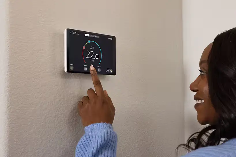 person using thermostat