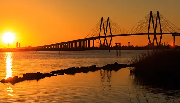 Fred Hartman bridge with a sunset backdrop